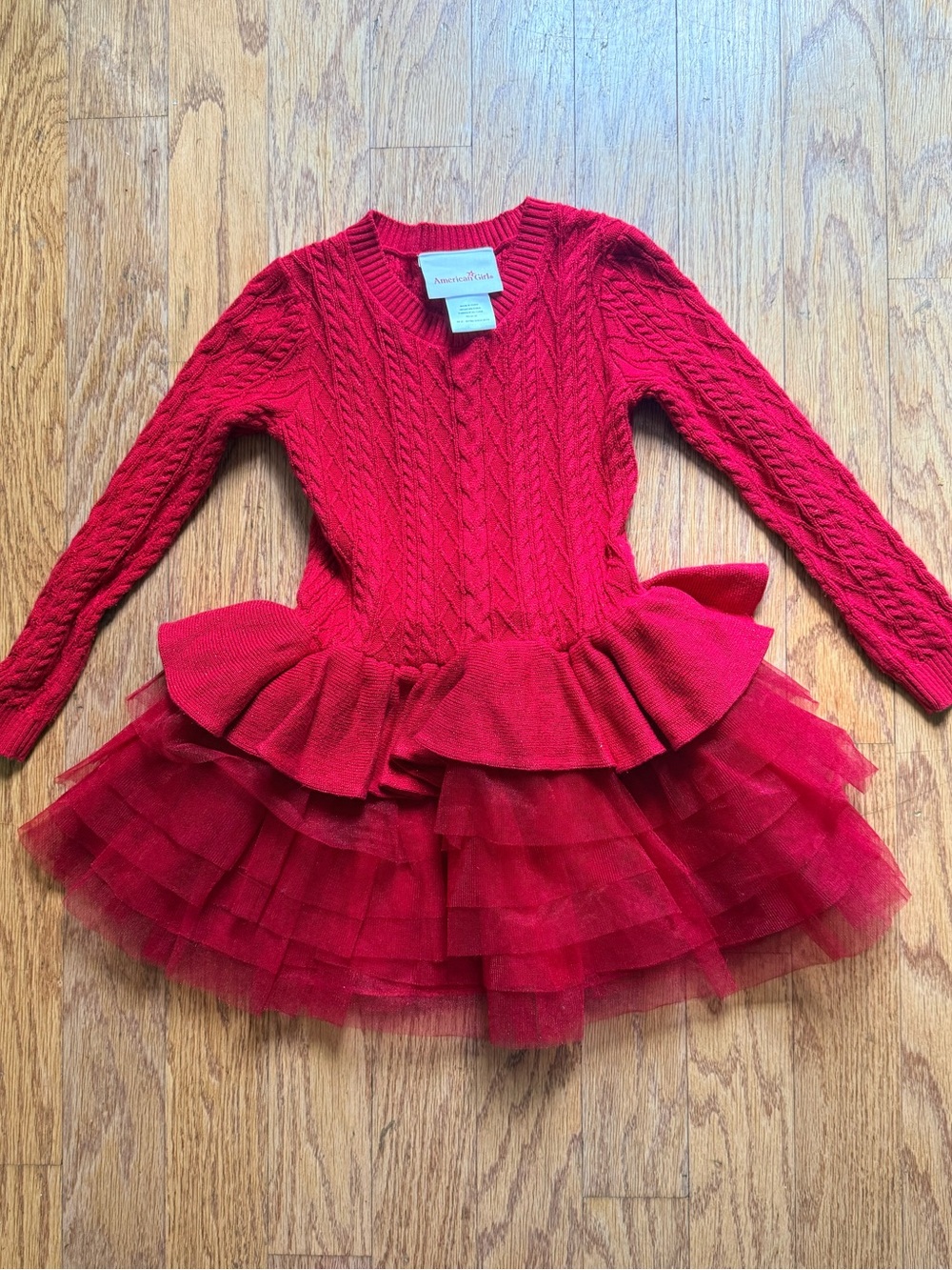 American Girl red cable-knit sweater dress with a layered tulle tutu skirt